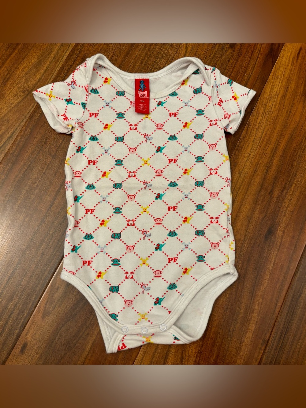 Small Paul by Paul Frank white short sleeve onesie.